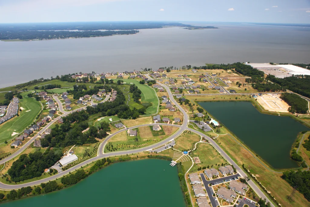 Aerial view of The Riverfront at Harbour View, with its lakes and golf course beside the river